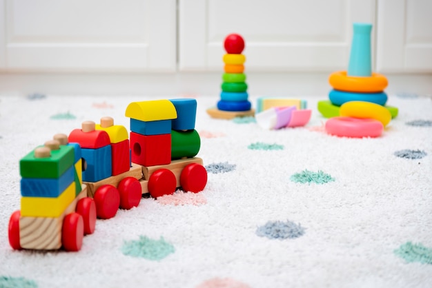 Premium Photo | Colorful baby toys on a carpet