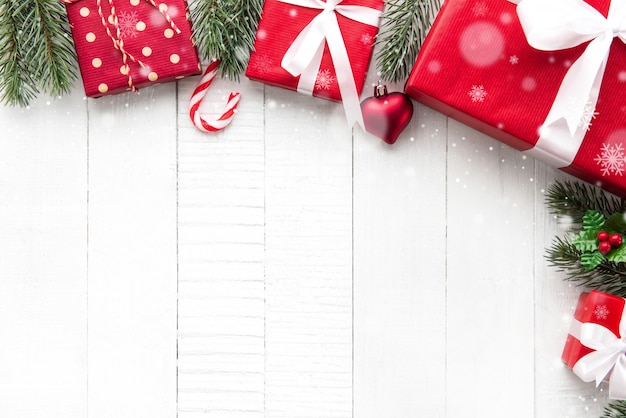 Premium Photo | Colorful christmas gift boxes on white wood background ...