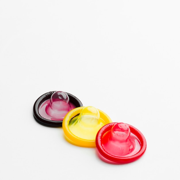 Free Photo | Colorful condoms on white background