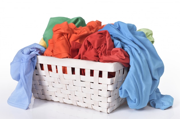Colorful dirty clothes in laundry basket Premium Photo