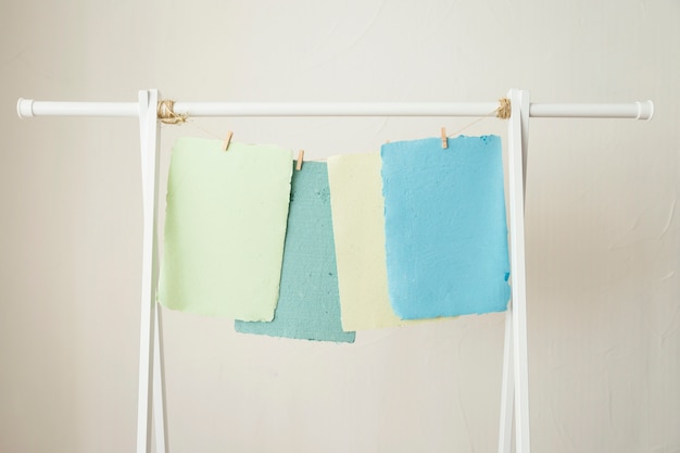 Free Photo | Colorful handmade papers drying on string