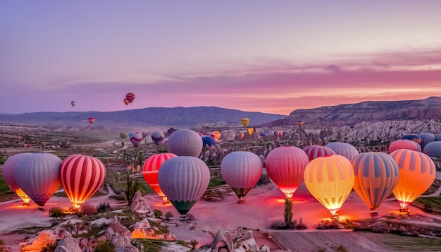 Colorful hot air balloons before launch in goreme national park, cappadocia, turkey Premium Photo