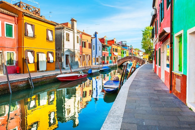 Premium Photo | Colorful houses with reflections on the canal in burano ...