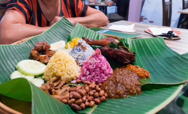 colorful nasi lemak malaysia traditional food green banana leaf table restaura 45051 9 - Biaya Makan di Malaysia, Cocok untuk Pelancong dan Tenaga Kerja di Negeri Jiran