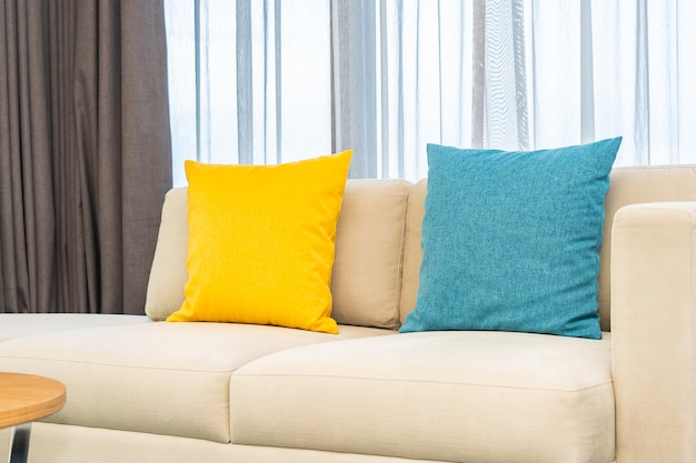 Colorful pillows on beige sofa Free Photo