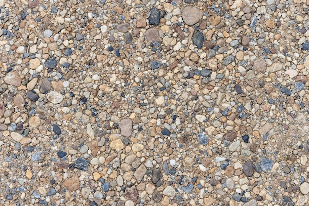 カラフルな砂や小石の質感 地面にシームレスなテクスチャです プレミアム写真