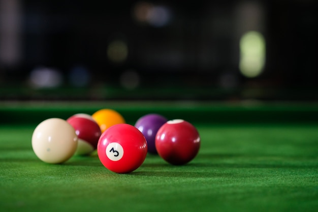 Premium Photo | Colorful snooker balls on green frieze.