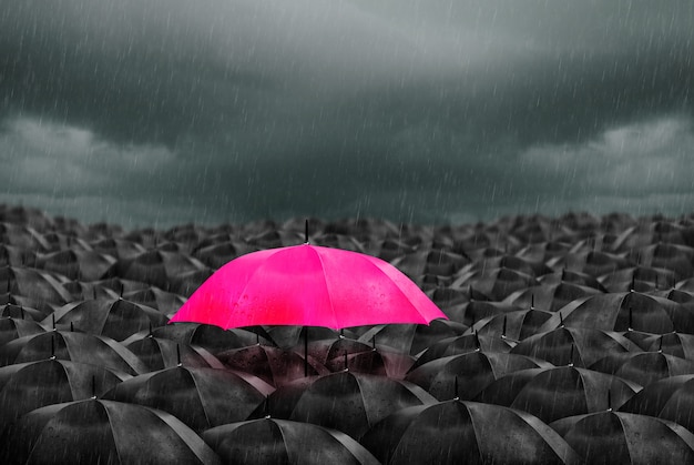 Premium Photo  Colorful umbrella  in mass of black  umbrellas  