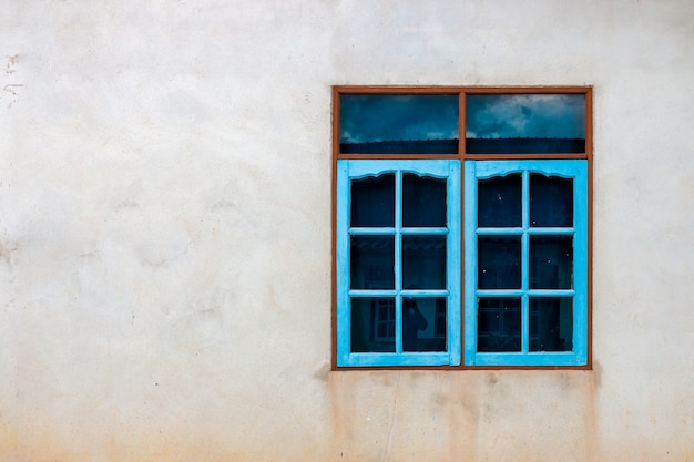 Premium Photo | Colorful window on a concrete wall