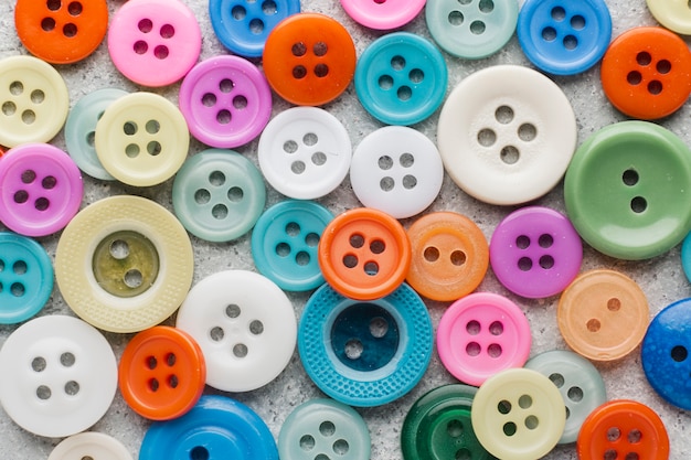 Premium Photo | Coloured sewing buttons composition background