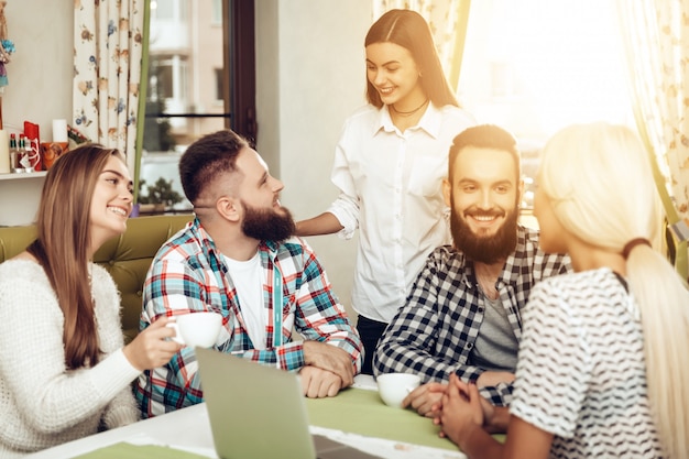 Premium Photo | A company of happy friends meeting in a restaurant