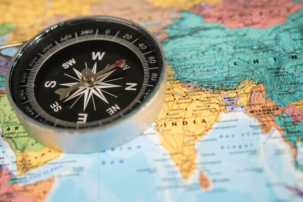 Premium Photo | Compass on asia globe world map