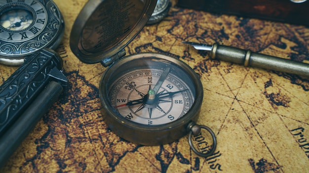 Compass on old world map Photo | Premium Download