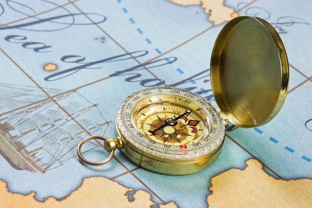 Premium Photo | Compass on a stylized map