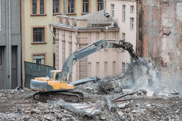 Complete highly mechanized demolition of building structures Premium Photo