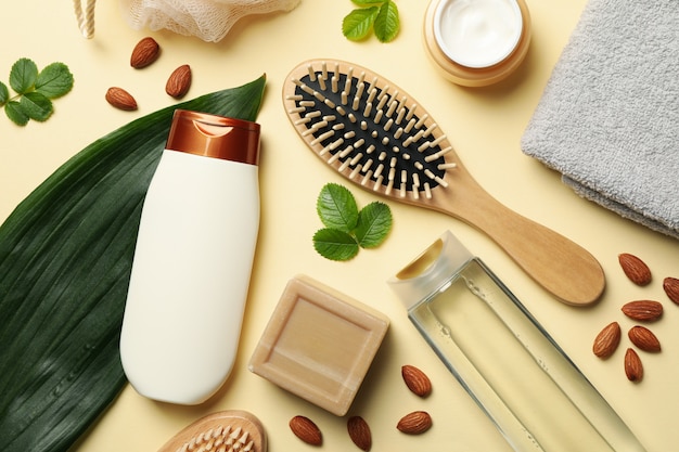 Composition of personal hygiene with bottles of cosmetics on beige background Premium Photo