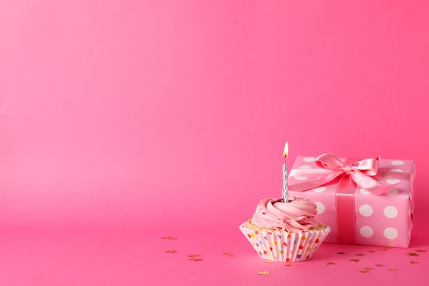 Premium Photo | Composition with cupcake and gift box on pink ...
