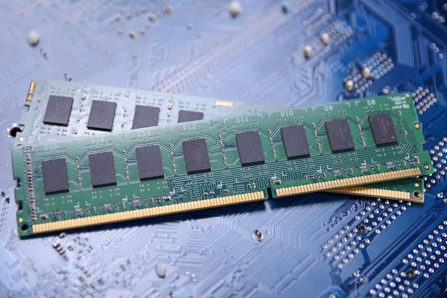 Computer memory ram on motherboard background . close up. system, main memory, random access memory, onboard, computer detail. computer components . ddr3. ddr4. ddr5 Premium Photo