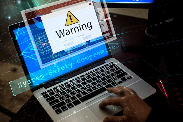 Computer with warning pop up sign window Premium Photo
