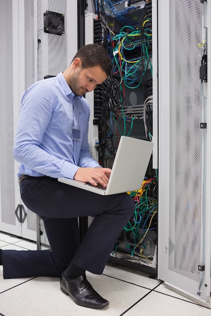 Premium Photo | Concentrated technician doing data storage