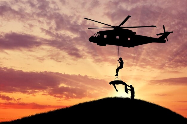 Premium Photo | Concept of the evacuation. silhouette helicopter ...