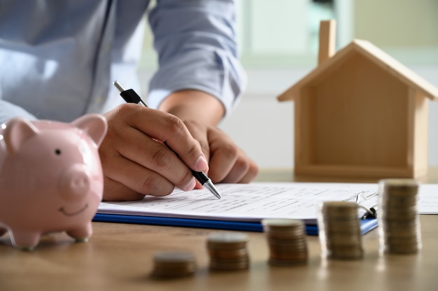 The concept of home ownership business people negotiating a contract this is where you need to sign Premium Photo