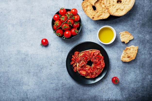 Premium Photo Concept Of Italian Food Friselle With Tomato Oil And Origano Top Down View With Copy Space