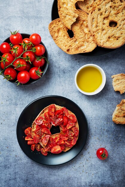 Premium Photo Concept Of Italian Food Friselle With Tomato Oil And Origano Top Down View With Copy Space