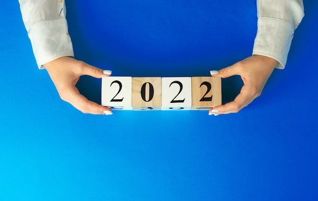 Premium Photo | Concept of the year 2022. 2022 numbers on blue