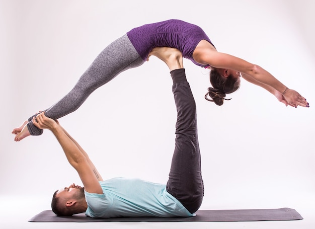 Free Photo | Concept of yoga exercises. young healthy couple in yoga ...