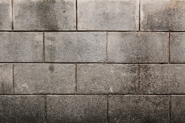 コンクリートブロック壁のシームレスな背景とテクスチャ プレミアム写真