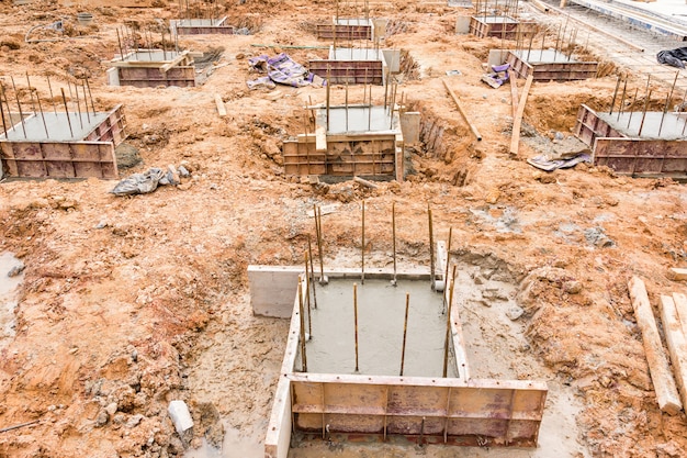 Premium Photo | Concrete pillar construction in site, temporary wood