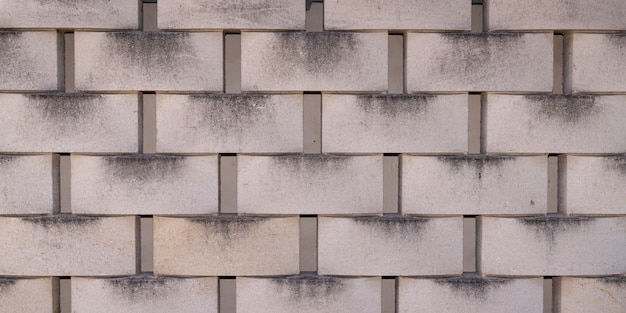 コンクリートタイルコンクリートブロック壁クラッディングテクスチャ灰色の背景 プレミアム写真