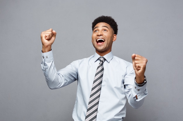 Premium Photo | Confident happy young african american throwing fists ...