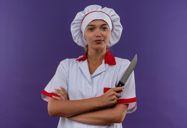 Free Photo Confident Young Cook Female Wearing Chef Uniform Crossing Hands Holding Knife On 1832