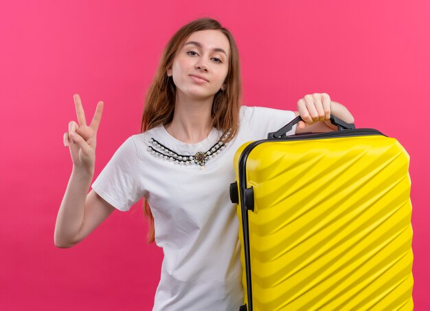 Free Photo | Confident young traveler girl holding suitcase doing peace ...