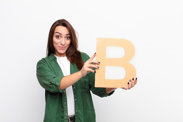 premium-photo-confused-doubtful-thinking-holding-the-letter-b-of