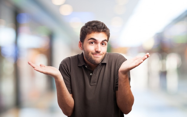 Confused guy on blurred background | Free Photo