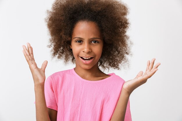 Premium Photo Confused Little African Girl Wearing Pink Blouse Standing Isolated Over White