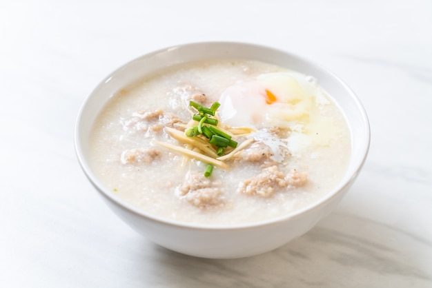 Premium Photo | Congee with minced pork in bowl
