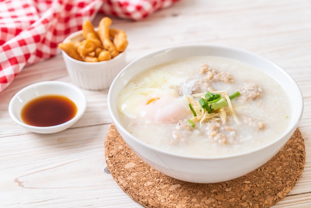 Premium Photo | Congee with minced pork in bowl