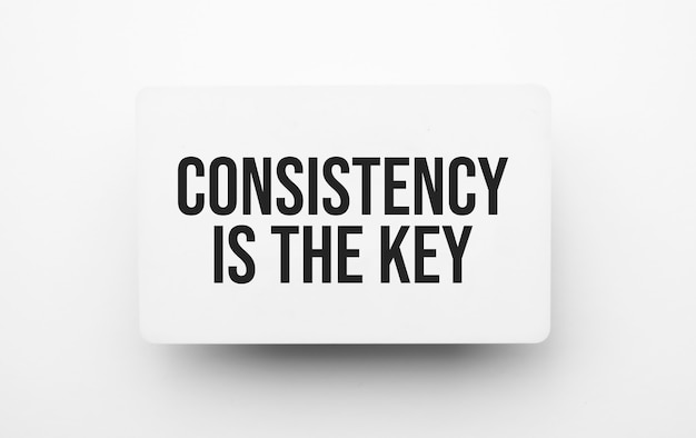 Premium Photo | Consistency is the key sign on notepad on the white ...