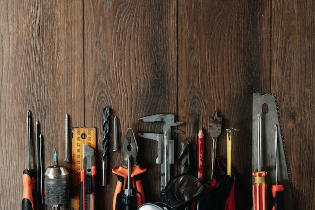 Premium Photo | A construction tool on a brown wooden . view from above ...