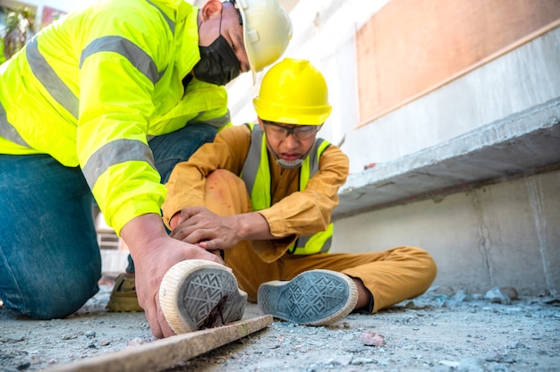 Premium Photo Construction Worker Has Accident Stepping On Nail At   Construction Worker Has Accident Stepping Nail Construction Site Emergency Help Engineer Provide First Aid Construction Workers Accident Safety Team Help Construction Worker Has Accident 41097 341 