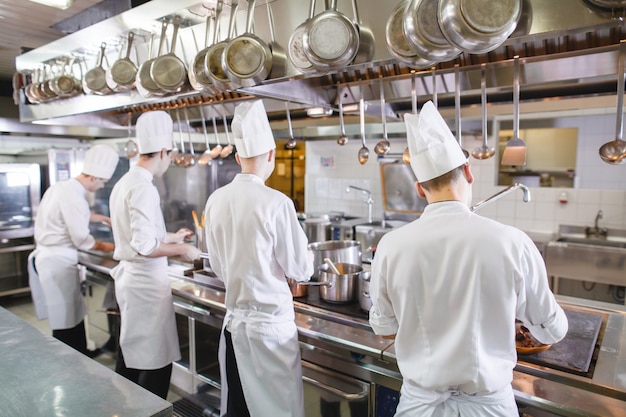 Premium Photo | Cook cooks in a restaurant.