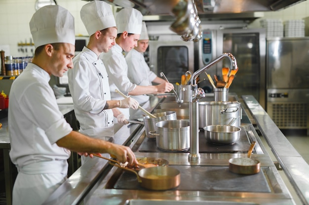 Premium Photo | Cook cooks in a restaurant.