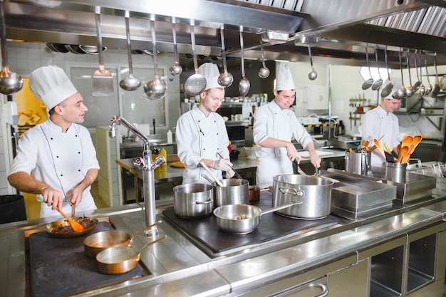 Premium Photo | Cook cooks in a restaurant.