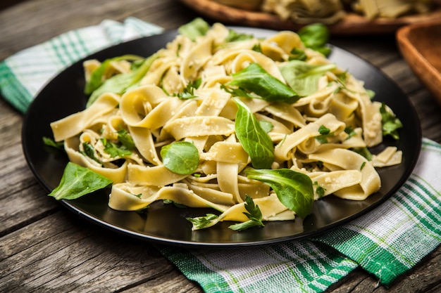 Premium Photo | Cooked tagliatelle on a plate