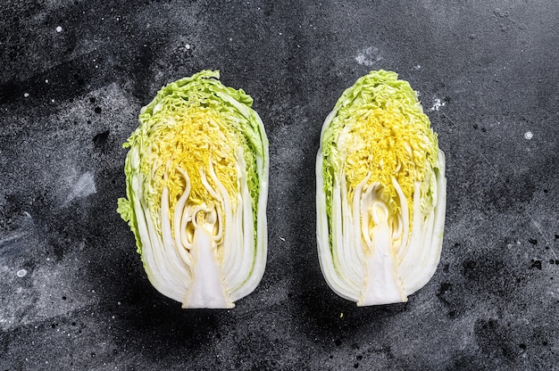 Cooking salad chinese cabbage. black background. top view. Premium Photo