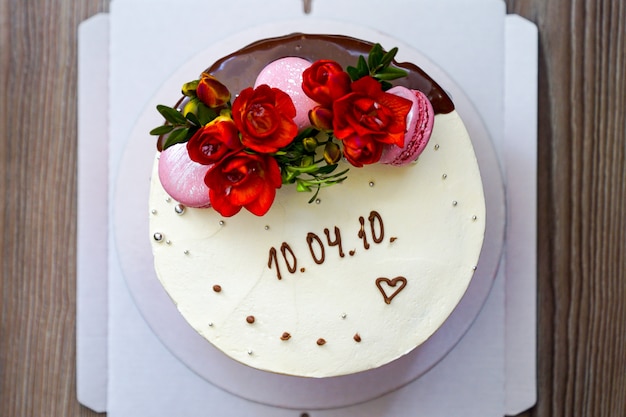 Cooking Sponge Cake Decorated With Fresh Flowers And Biscuit